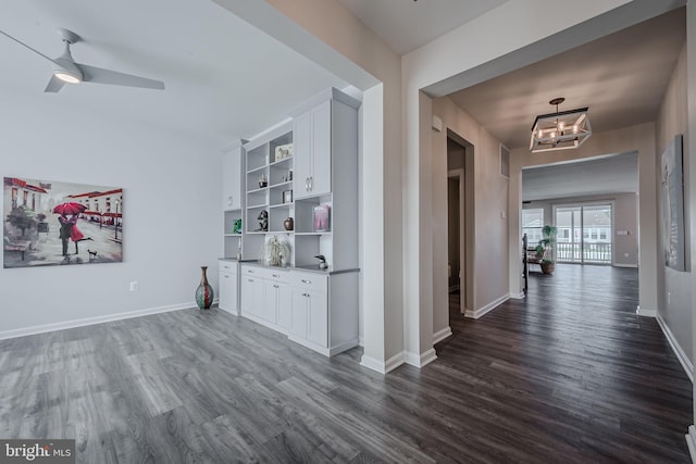 corridor with dark hardwood / wood-style floors