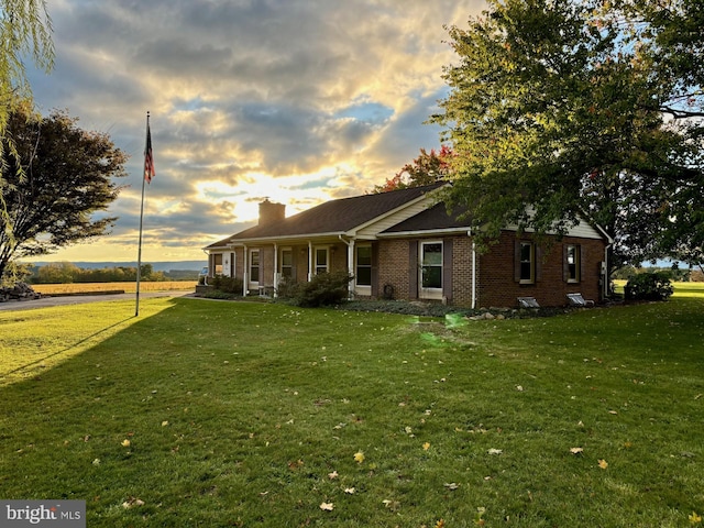 view of front of property with a lawn