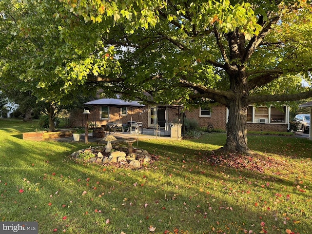 view of front of property featuring a patio area and a front lawn