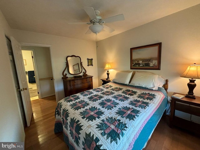 bedroom with ceiling fan and dark wood-type flooring