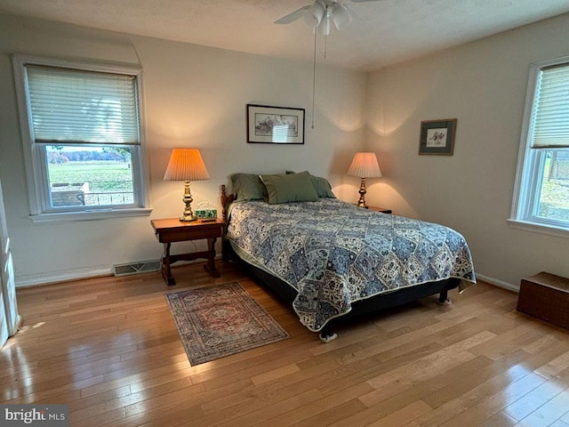 bedroom featuring ceiling fan and light wood-type flooring