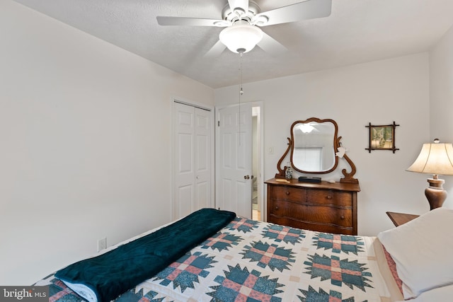 bedroom with ceiling fan and a closet