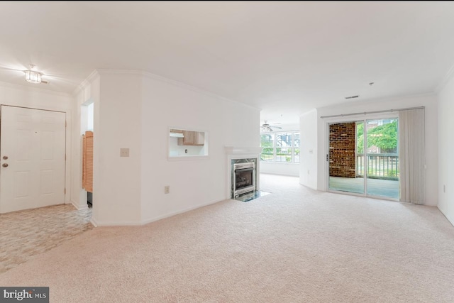 unfurnished living room featuring crown molding and light carpet