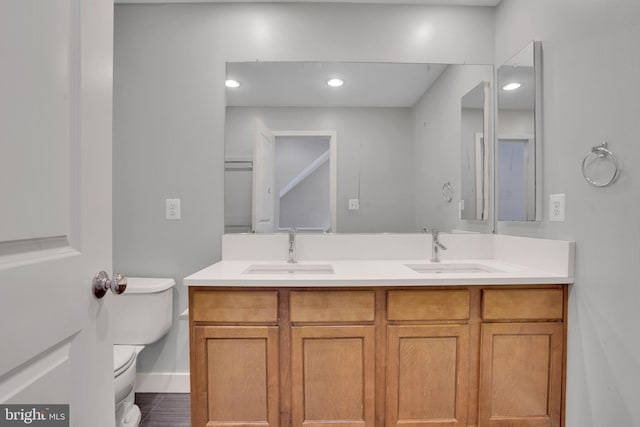 bathroom with tile patterned floors, vanity, and toilet