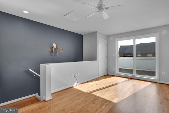 empty room featuring light hardwood / wood-style floors and ceiling fan