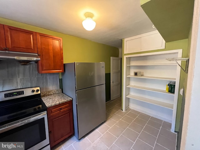 kitchen with light tile patterned floors and appliances with stainless steel finishes