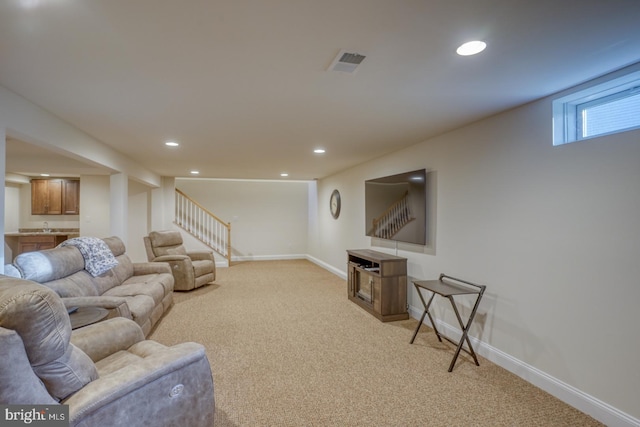 102 Serenity Cir, Middletown, DE 19709 - living room featuring stairway, light colored carpet, baseboards, recessed lighting, and bar