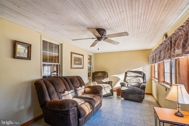 tiled living room with ceiling fan