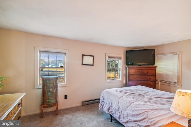 carpeted bedroom with a baseboard radiator