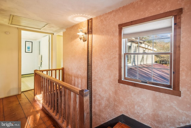 hall with hardwood / wood-style floors