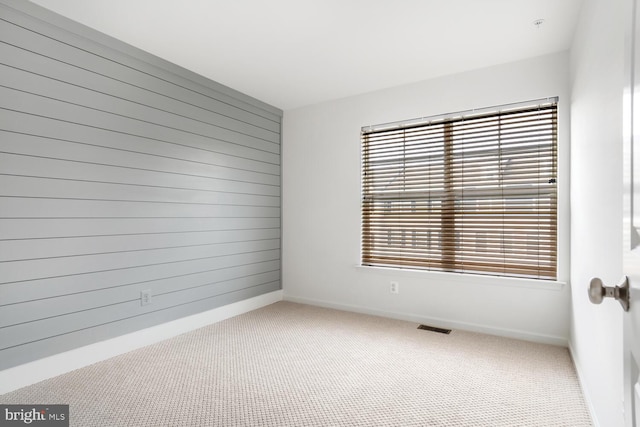 spare room featuring carpet flooring