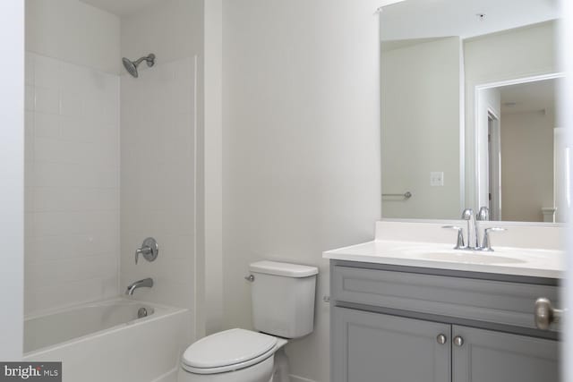 full bathroom with vanity, toilet, and tiled shower / bath