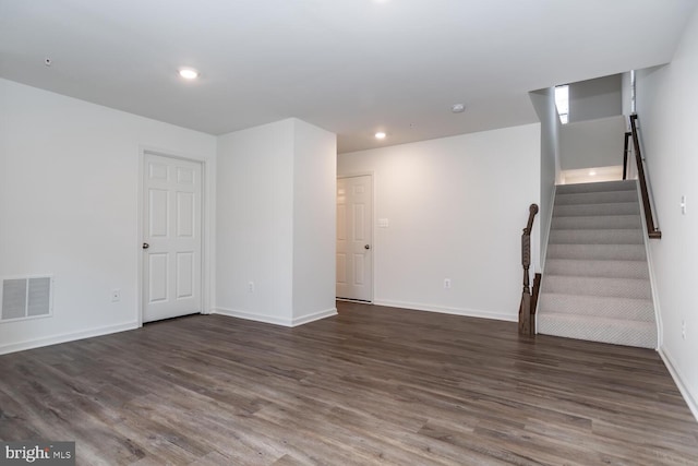 unfurnished room with dark hardwood / wood-style floors