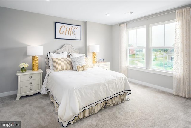 bedroom featuring light carpet