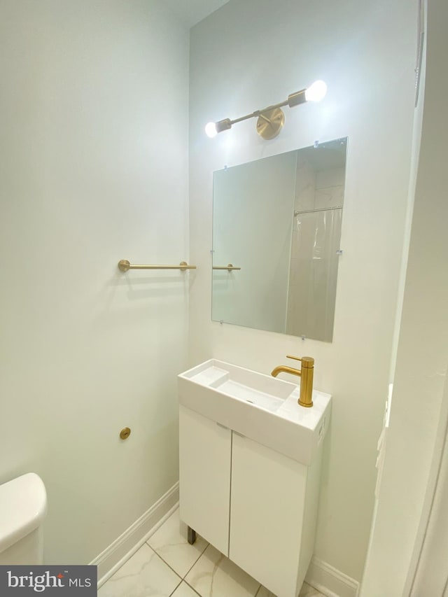 bathroom featuring vanity, toilet, and a shower