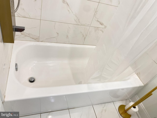 bathroom featuring a tub to relax in