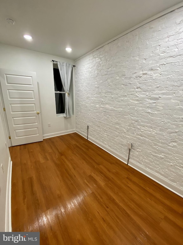 empty room featuring hardwood / wood-style floors