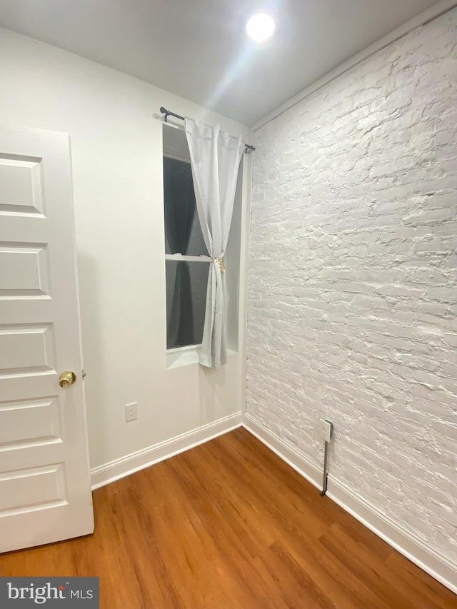 empty room featuring wood-type flooring