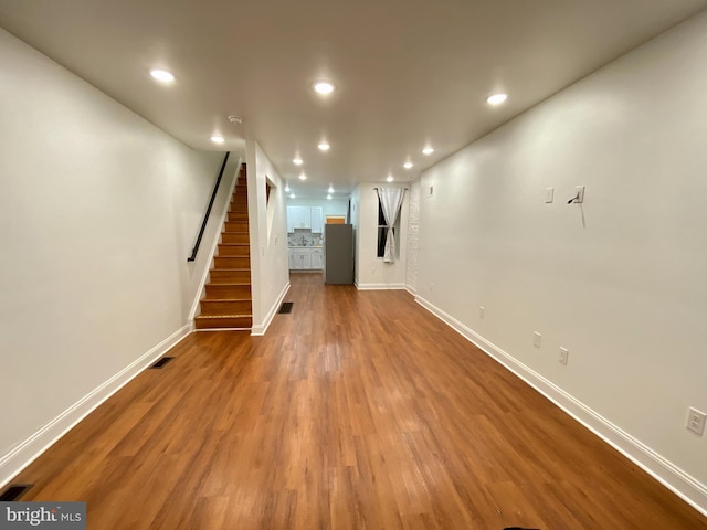 basement featuring hardwood / wood-style flooring