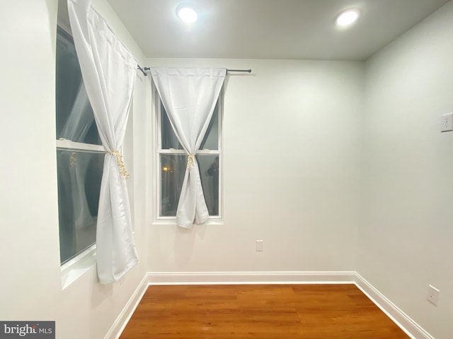 spare room featuring hardwood / wood-style flooring