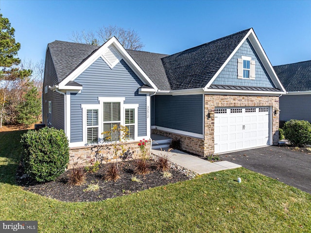 craftsman inspired home with a front yard and a garage