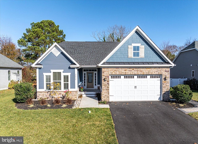 view of front facade with a garage and a front lawn