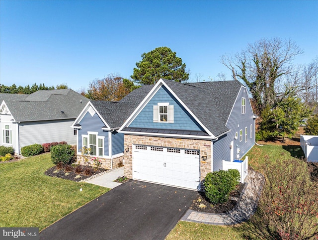 view of front of house featuring a garage and a front yard