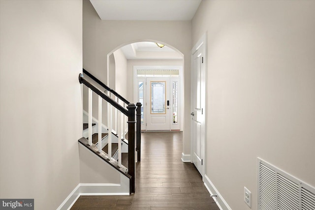 foyer entrance with dark hardwood / wood-style flooring