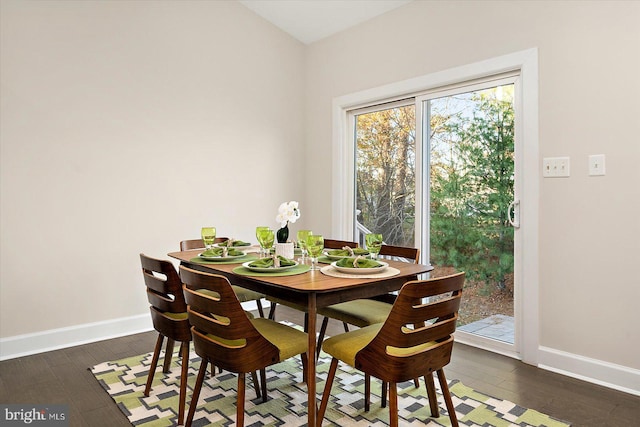 dining room with dark hardwood / wood-style floors