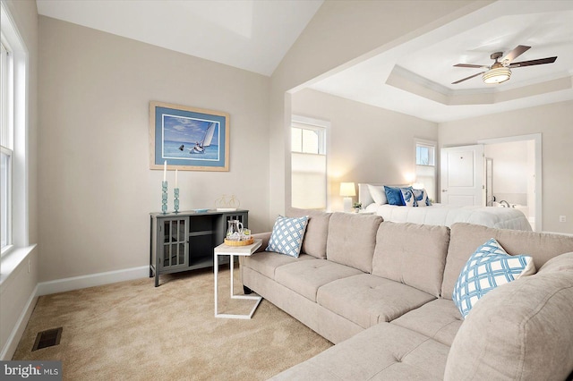 carpeted living room featuring ceiling fan