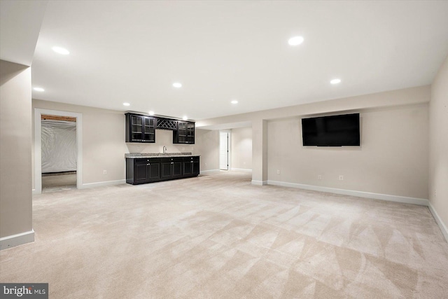 unfurnished living room featuring light carpet