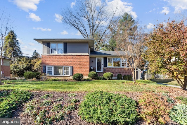 tri-level home with a front yard