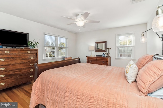 bedroom featuring hardwood / wood-style flooring and ceiling fan