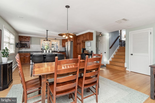 dining area with light wood-type flooring