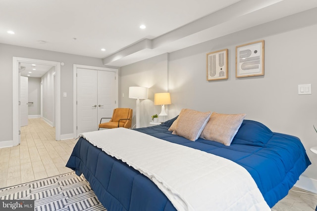 bedroom with a closet and light wood-type flooring