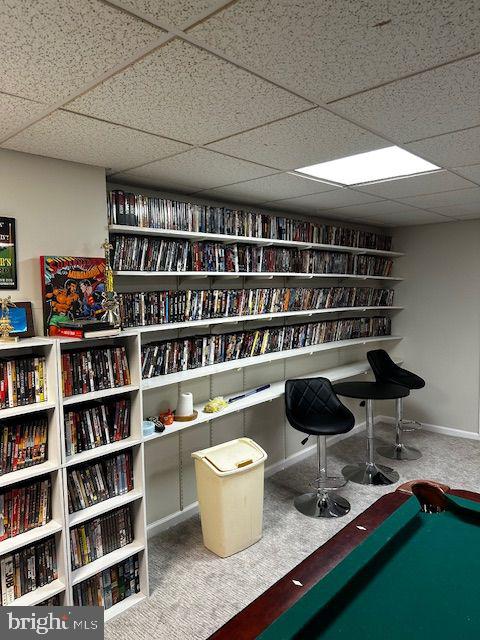 recreation room featuring a drop ceiling, carpet floors, and pool table