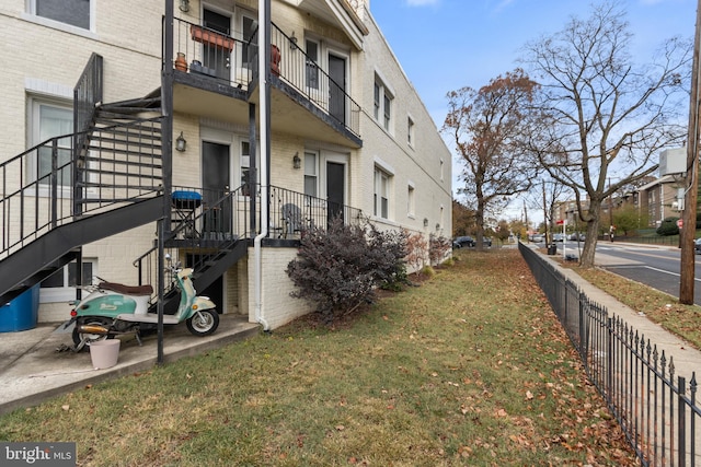 view of home's exterior with a lawn