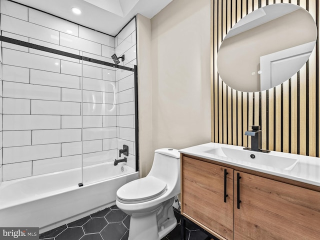 full bathroom featuring tile patterned floors, vanity, toilet, and tiled shower / bath