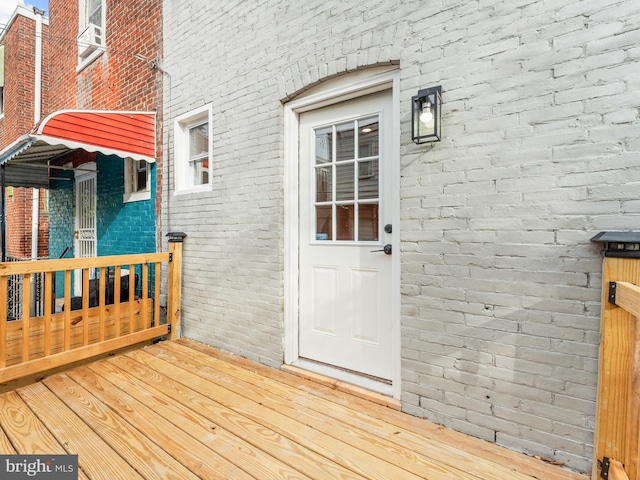 property entrance with a deck