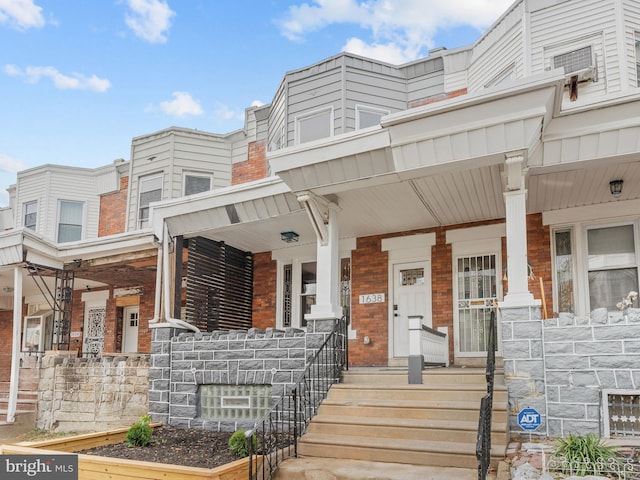 view of property with a porch