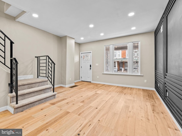 foyer entrance with light hardwood / wood-style flooring