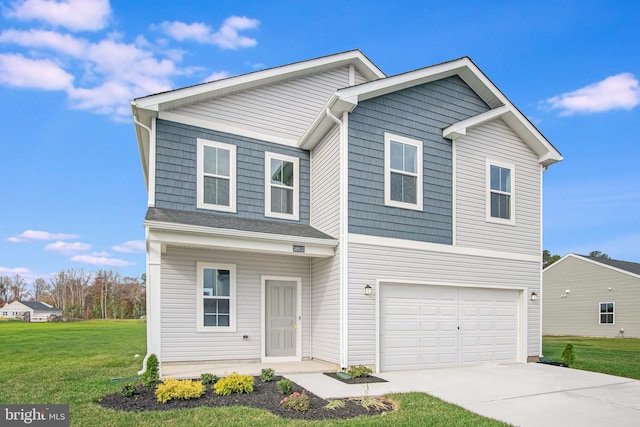 view of front of house with a front lawn and a garage