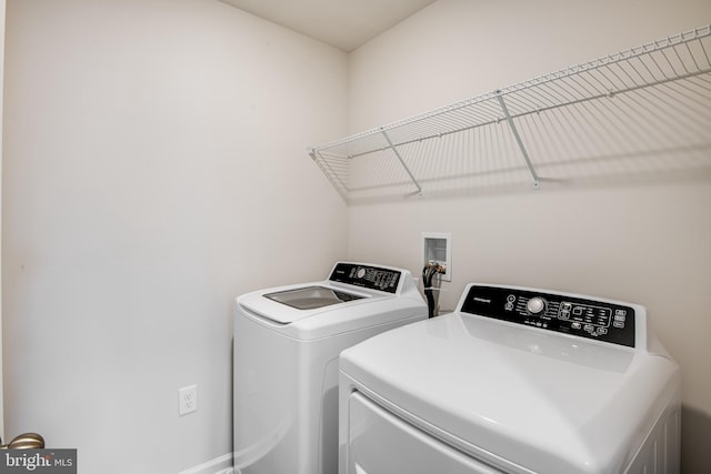 washroom with washing machine and dryer