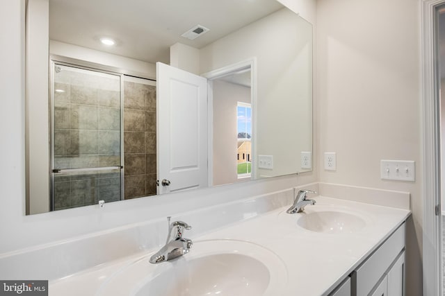 bathroom with vanity and an enclosed shower