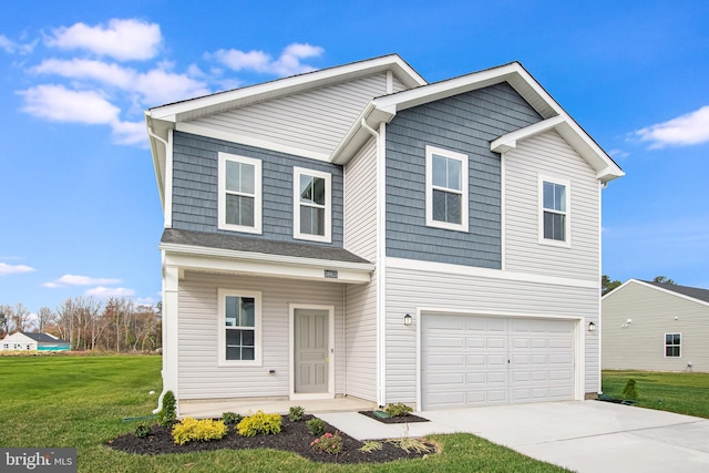 view of front facade with a garage and a front lawn