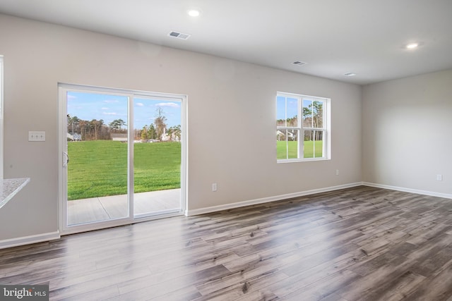 spare room featuring hardwood / wood-style floors