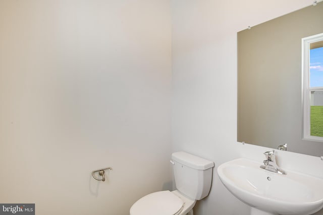 bathroom with toilet and sink