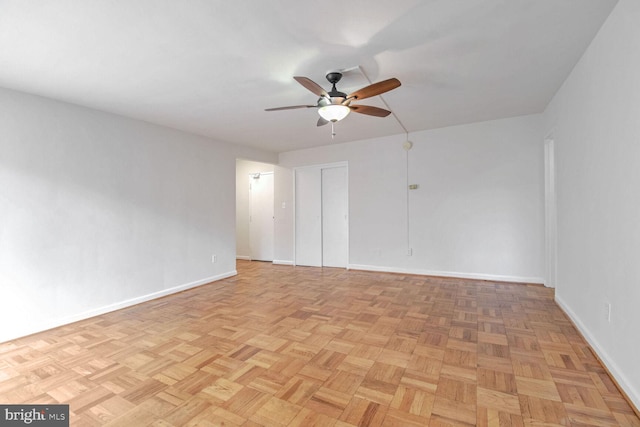 unfurnished room featuring light parquet floors and ceiling fan