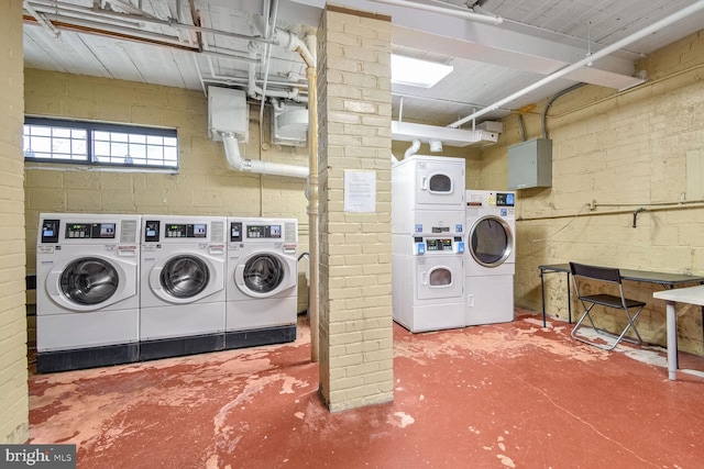 laundry area featuring independent washer and dryer and stacked washing maching and dryer