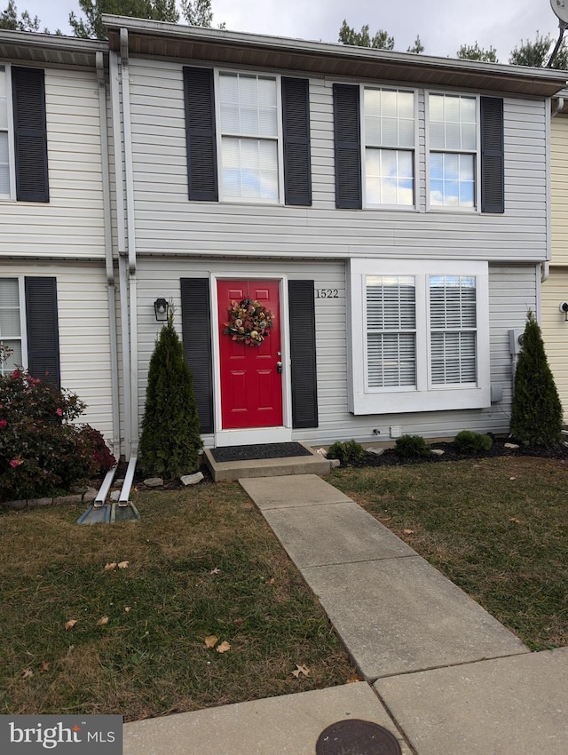 view of property featuring a front yard